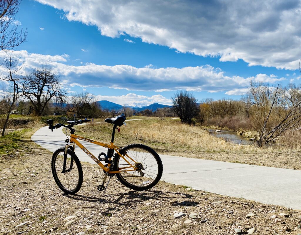 a bike parked on the side of the City of Loveland Recreation Trail