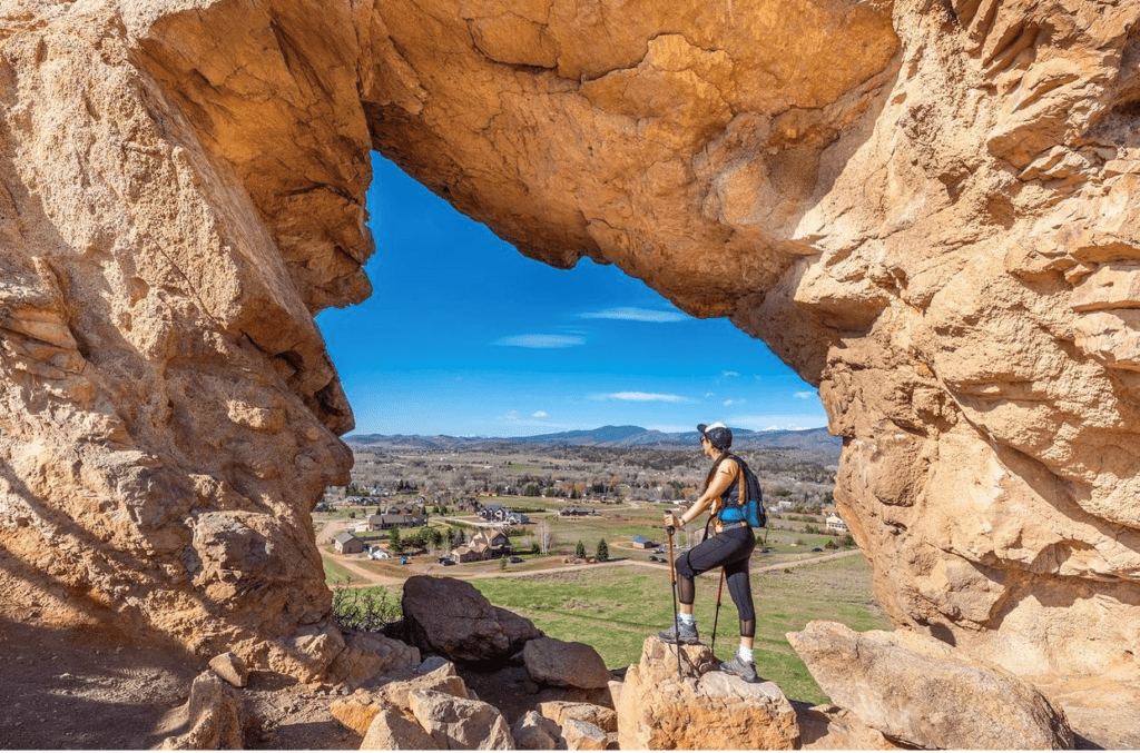 A hiker standing in the keyhole at Devil's Backbone Trail Loveland CO