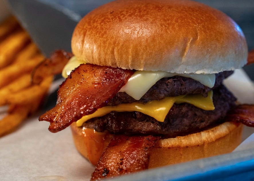 Bacon Cheese Burger and fries from Good Times