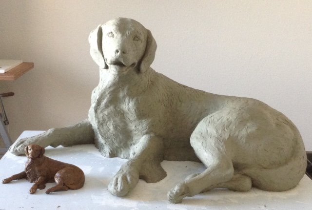Two clay dog statues from Sculpture Depot