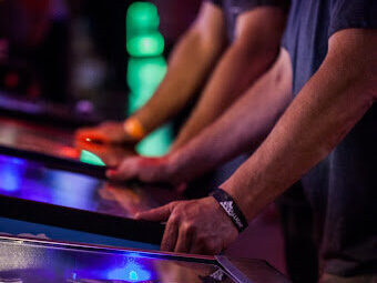 People playing pinball