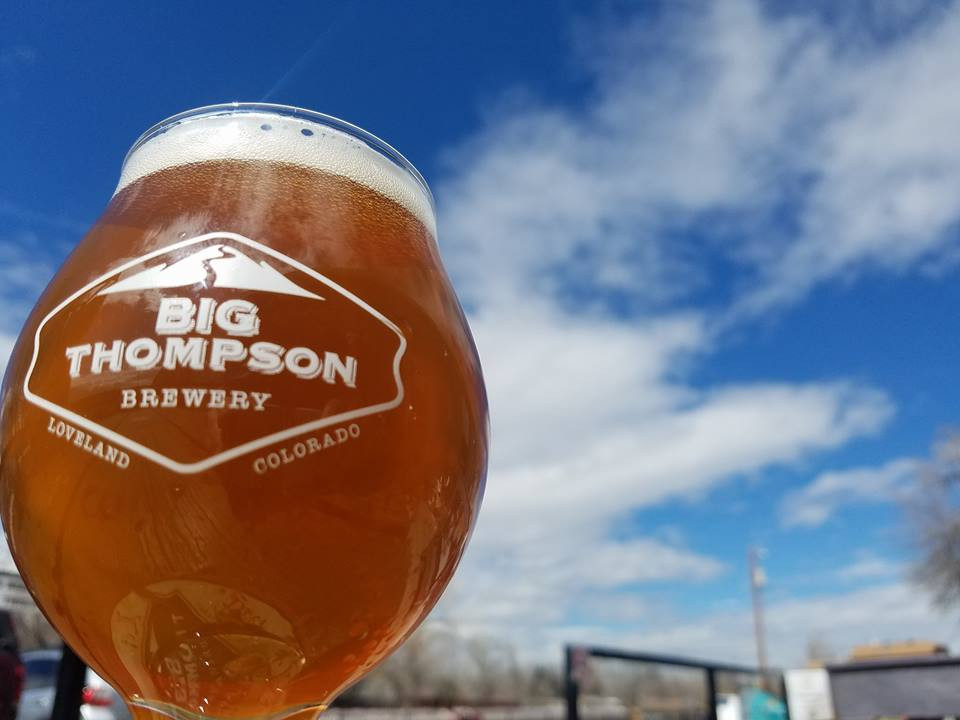 Big Thompson brewing beer in front of a blue sky