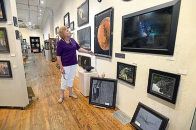 A woman looks at art in the Independence Gallery in Loveland