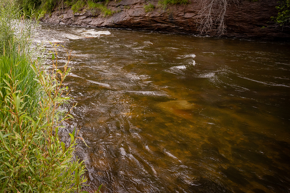 Water flows by the banks of the Big Thompson River in Loveland.