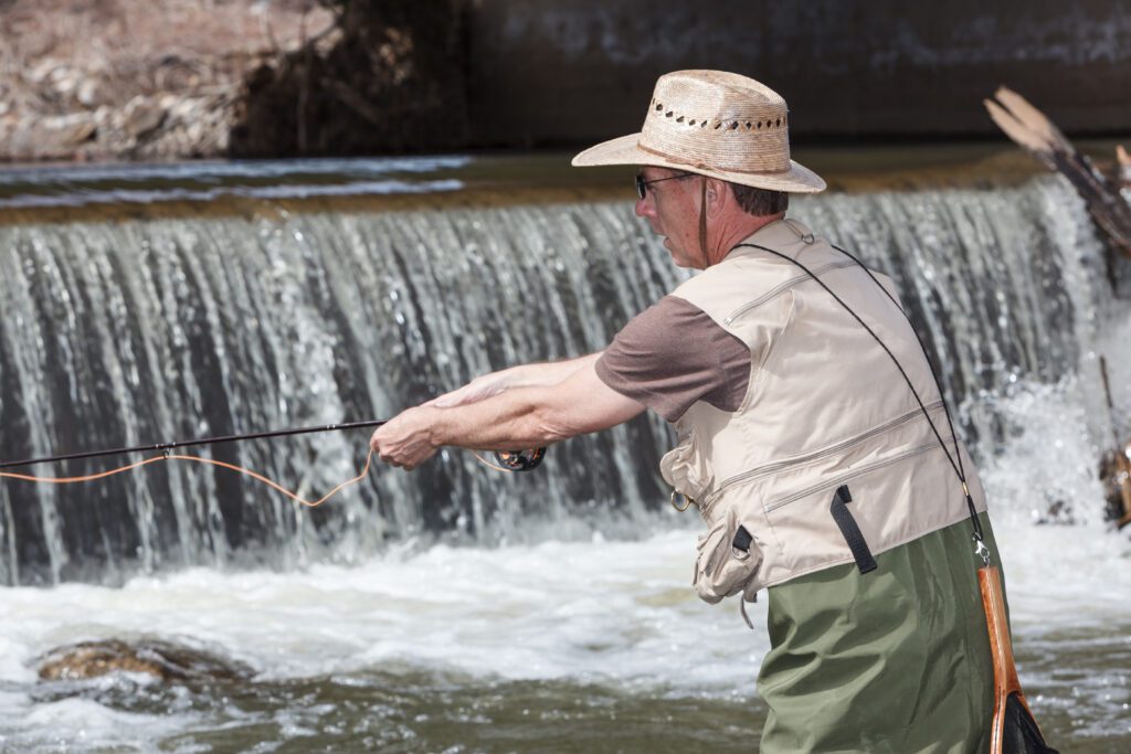 A man fly fishing in the Big Thompson River