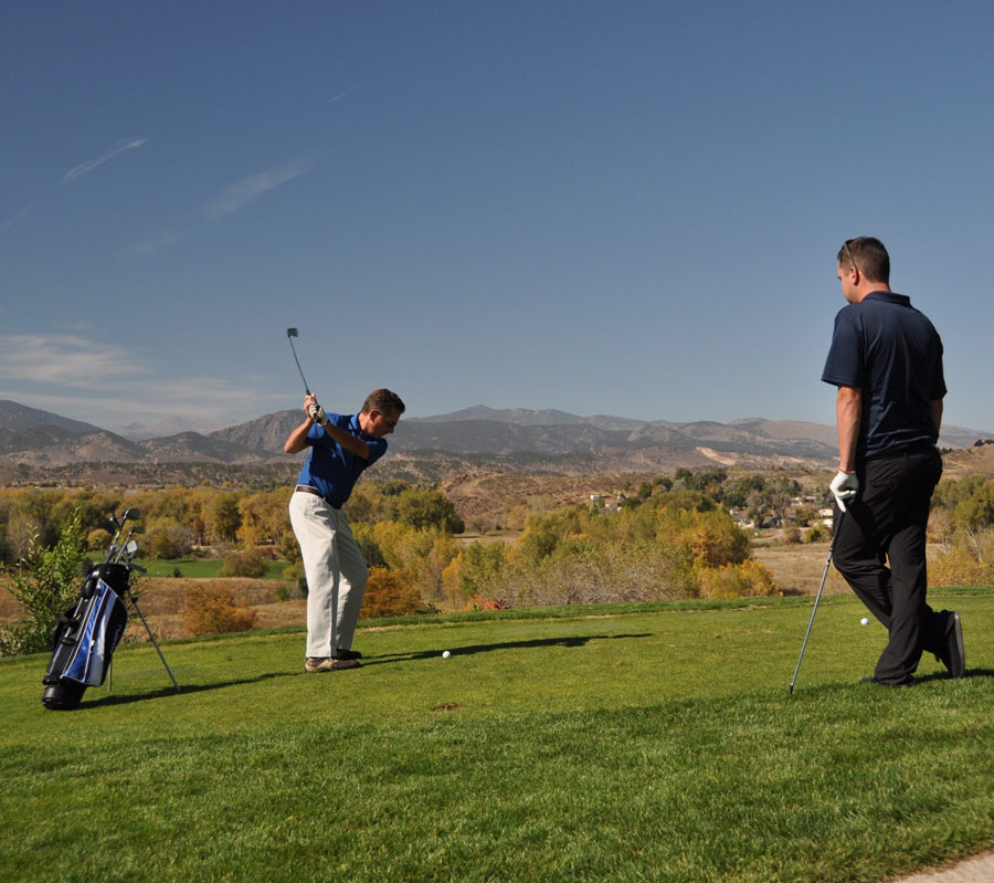 A man prepares to hit a golf ball at Mariana Butte Golf Course in Loveland, Colorado