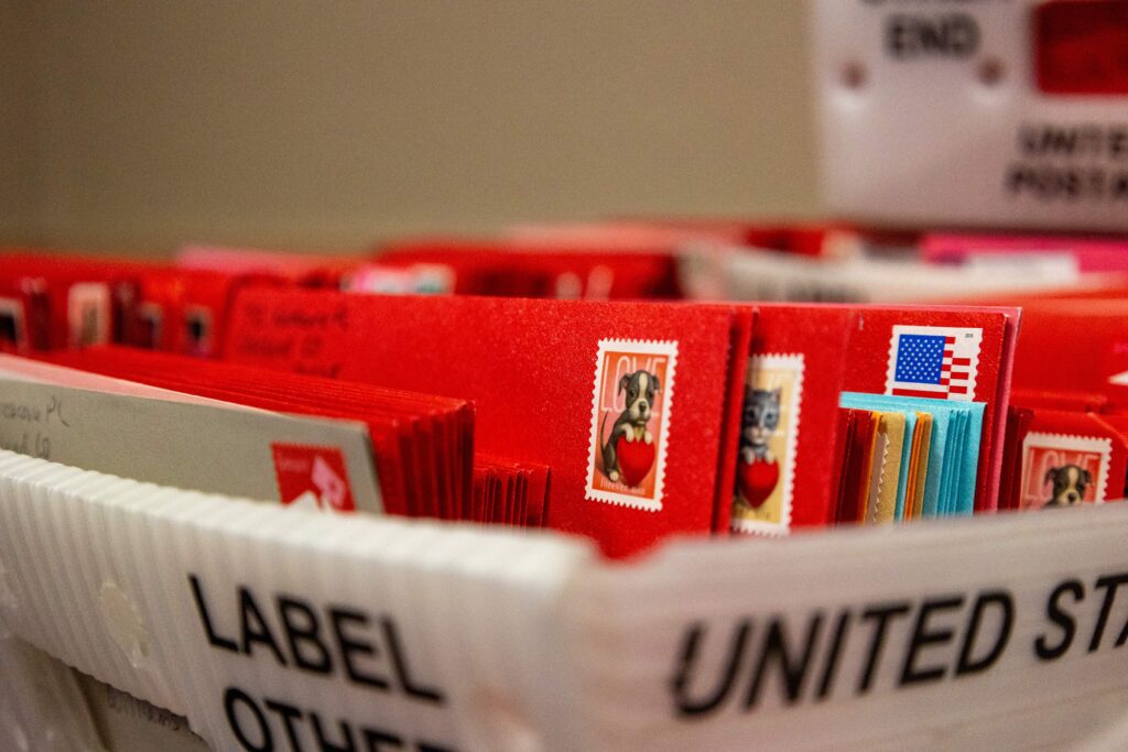 Crates of Valentines sit at the Loveland Chamber of Commerce awaiting restamping.