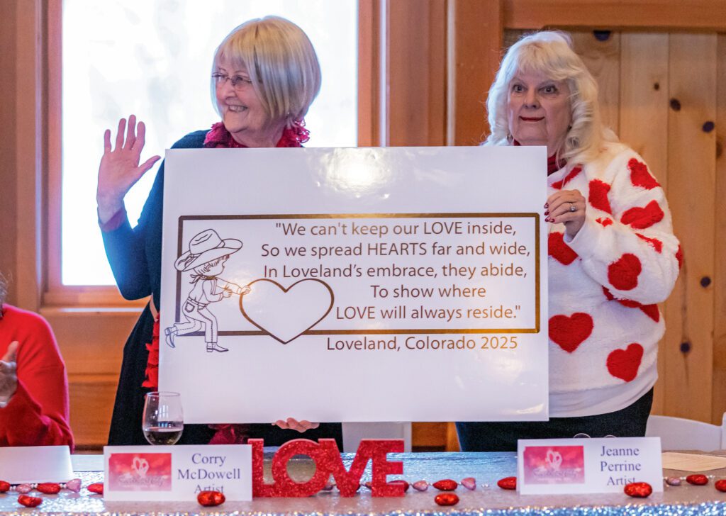 Corry McDowell and Jeanne Perrine present the 2025 Official Loveland Valentine Card verse at a press conference on January 7, 2025.