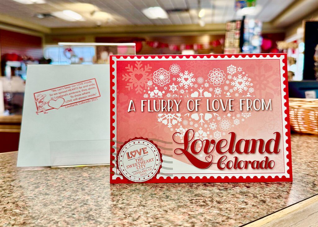 The 2025 Loveland Valentine Card sits on display at the Loveland Visitors Center.