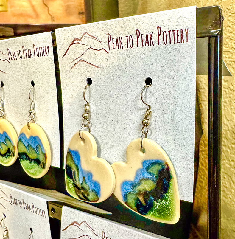 Heart earrings from Peak to Peak Pottery on display in the Loveland Visitors Center.