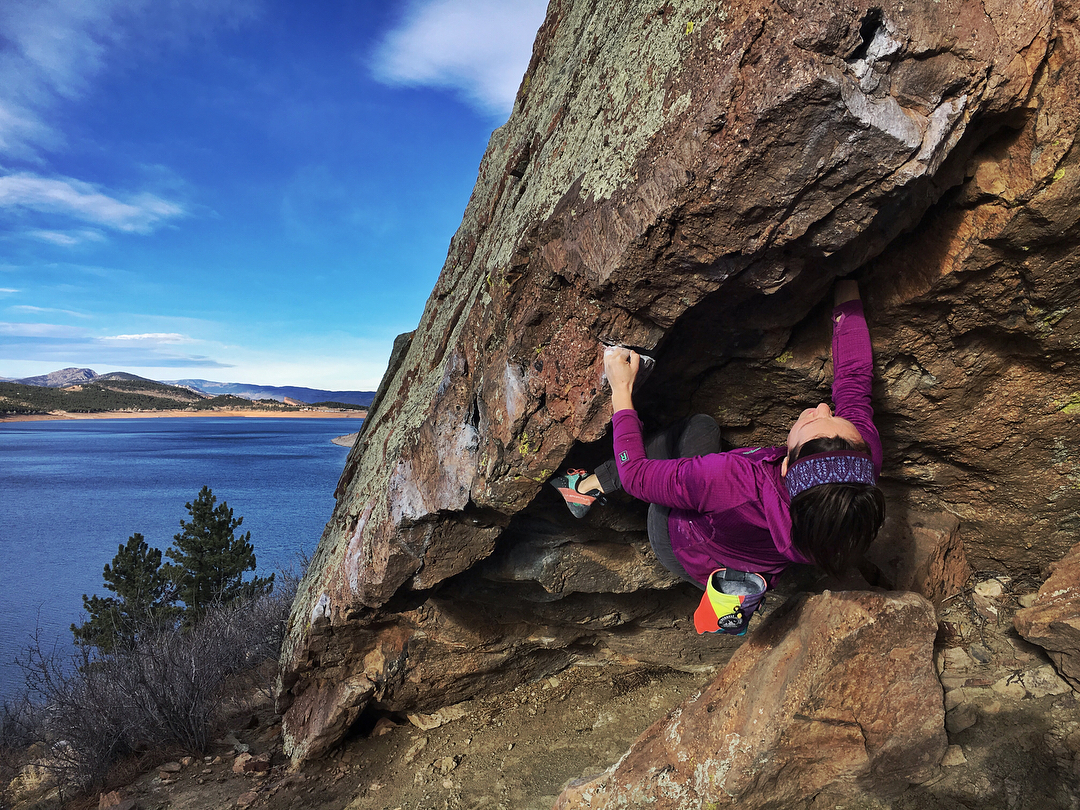 A woman clibs a rock face at Carter Lake in Loveland, Colorado