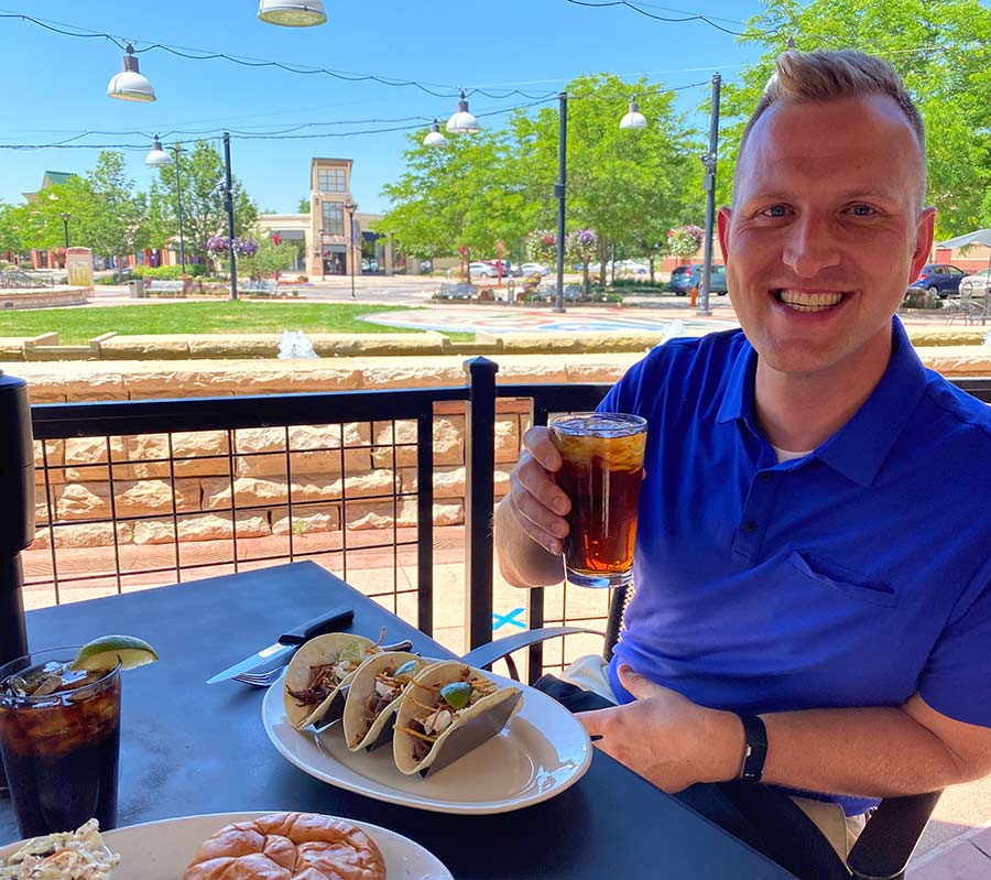 Man enjoying dinner and a beer at Bent Fork in Loveland, Colorado