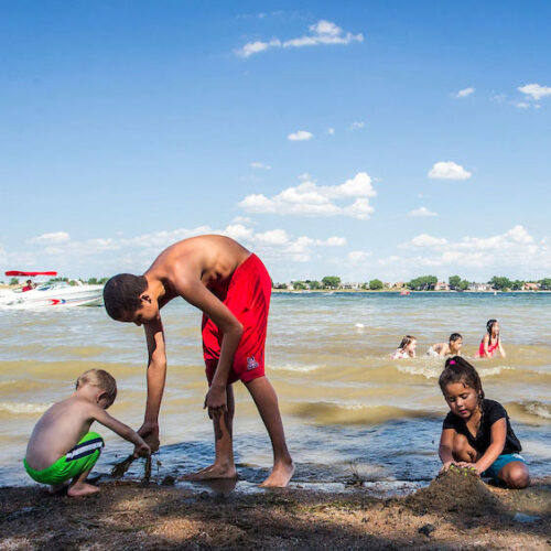 People on the beach at Boyd Lake in Loveland, Colorado