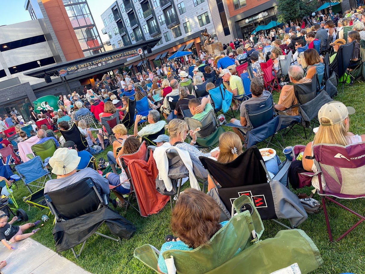 Crowd sitting at the lawn at the Foundry for One Sweet Summer Concert