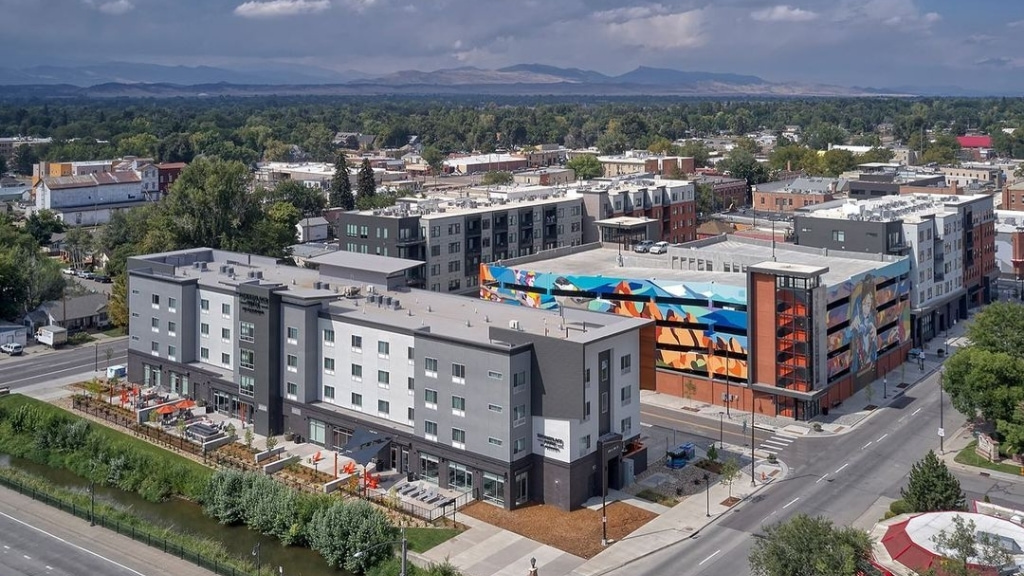 Aerial view of Downtown Loveland, Colorado, showing the city center and surrounding Front Range landscape.