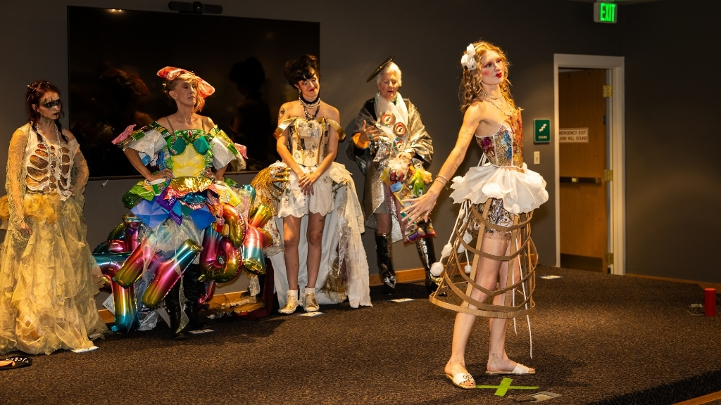 Models showcase creative outfits made from recycled materials at the Re: Fashion Trash Fashion Show in Loveland, Colorado.
