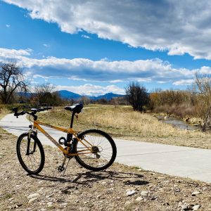 a bike parked on the side of the City of Loveland Recreation Trail