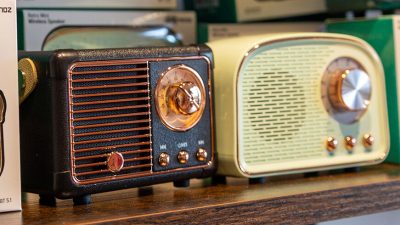 Mini retro bluetooth radios sit on a shelf at the Downtown Loveland Visitors Center